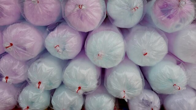 Making cotton candy or candy floss in street food market
