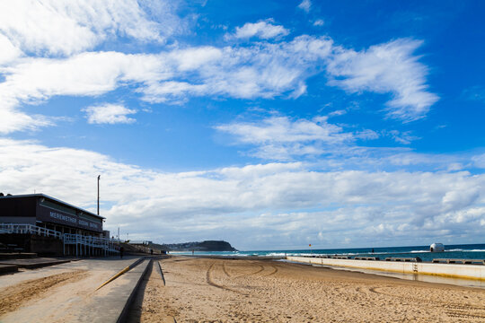 Seaside scene at Merewether looking along beach to the ocean
