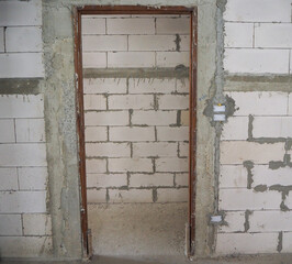 Door jamb installation in the concrete wall