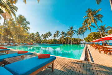 Outdoor tourism wellbeing landscape. Luxury beach resort spa swimming pool leisure beach chairs...