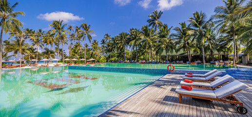 Outdoor tourism wellbeing landscape. Luxury beach resort spa swimming pool leisure beach chairs...