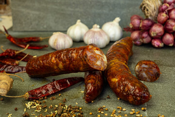 Yunnan Chinese sausage with spices sitting on a stone plate