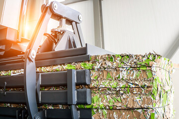 paper recycling truck and forklift loading old papers