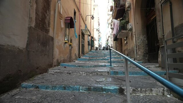Naples, Italy - May 7, 2023: a street in the old historic center of Naples, Italy. Naples, center of city old Spanish quarter street with famous landmark, touristic attraction street art