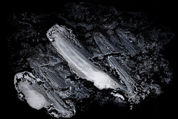 Naklejka premium White Paint Smears On A Black Background