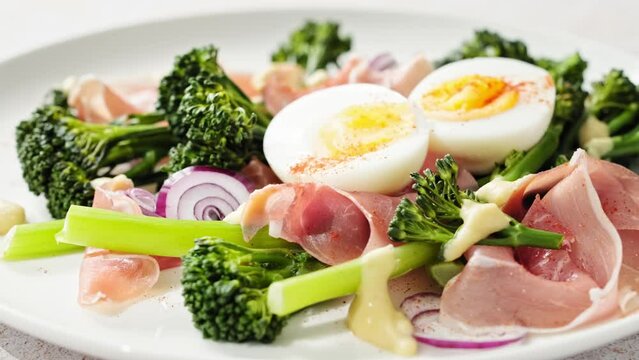 Easter egg salad with prosciutto and broccoli, stock footage video 4k