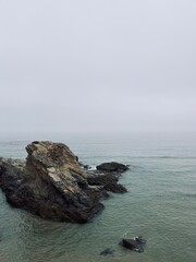 Rocky ocean coast, ocean bay, blue sky
