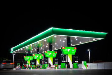 green petrol station at night - 729339061