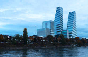 River view at multistorey office buildings in cloudy sky on a bleak day (Basel, Switzerland)