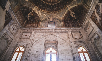 Interior of an ancient mosque with decoration in the ancient city of Bukhara in Uzbekistan on a cloudy summer day