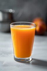 freshly squeezed peach juice in a glass