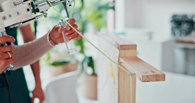 Wool, machine and hands of person with craft, rug tufting and creativity in art class or workshop. Yarn, gun and textile artist closeup learning with fabric for project on wood, frame or canvas