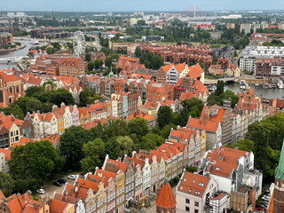 Stunning view from above of Gdańsk old town with multicolored beautiful architecture buildings and red roofs