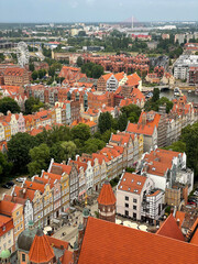 Fototapeta na wymiar Stunning view from above of Gdańsk old town with multicolored beautiful architecture buildings and red roofs