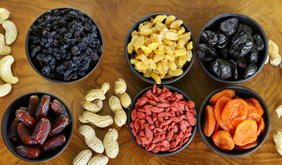 assorted dried fruits dried apricots dates raisins in bowls
