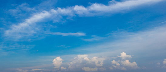 view of bright blue sky with white clouds
