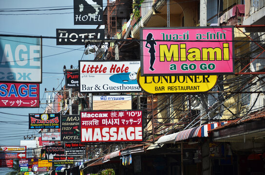 Massage and other multicolored signs on the street of Beach Road