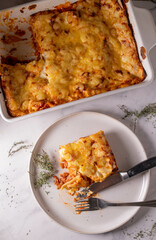 Tuna Casserole with tomato sauce, bechamel sauce and cheese crust