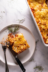 Tuna Casserole with tomato sauce, bechamel sauce and cheese crust