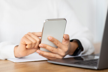 Cropped of woman independent contractor using gadgets