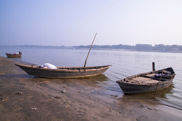 landscape view of Some wooden fishing boats on the shore of the Padma river in Bangladesh