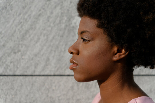 Black girl outdoors, Milano, Italy.