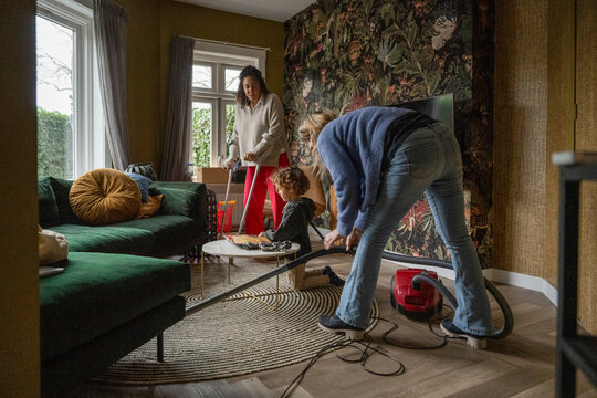 Family Bonding And Cleaning Their Apartment