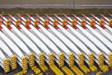 Aerial image of wind turbine parts stacked in container port being ready to ship. Bremerhaven, Germany