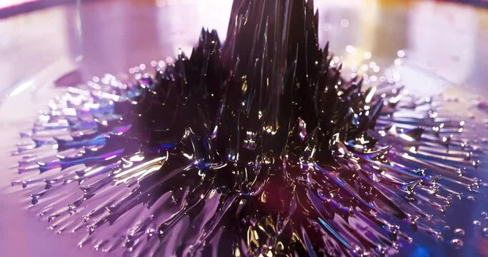 Ferromagnetic fluid. Viscous ferrofluid spike-like shape. Ferromagnetic fluid creates amazing drawings spikes in magnetic field, appearing and disappearing. Real ferromagnetic fluid in action