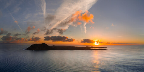 Spectacular golden hour sun rise over the volcanic island Isla de Lobos, near Corralejo, Fuerteventura, Canary Islands Spain
