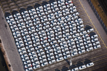 White cars in port being ready to be loaded onto ship. Bremerhaven, Germany