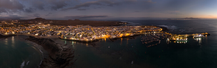 Spectacular aerial panoramic landscape image of the evening night sky over the town of Corralejo, Fuerteventura, Canary Islands, Spain