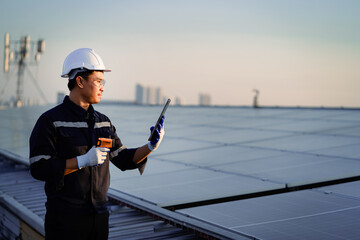 Professional green energy engineer walks on solar panels. Technician is inspecting a sustainable...