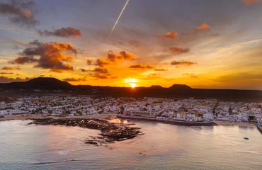Papier Peint photo Lavable les îles Canaries Spectacular aerial panoramic landscape image of the evening sunset sky at golden hour over the town of Corralejo, Fuerteventura, Canary Islands, Spain
