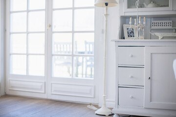 Interior still life of white interior decorated house in a shabby chic style.