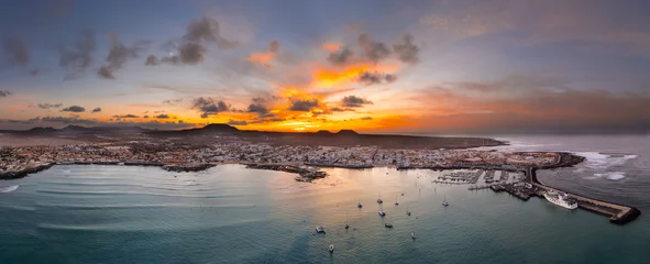 Papier Peint photo les îles Canaries Spectacular aerial panoramic landscape image of the evening sunset sky at golden hour over the town of Corralejo, Fuerteventura, Canary Islands, Spain