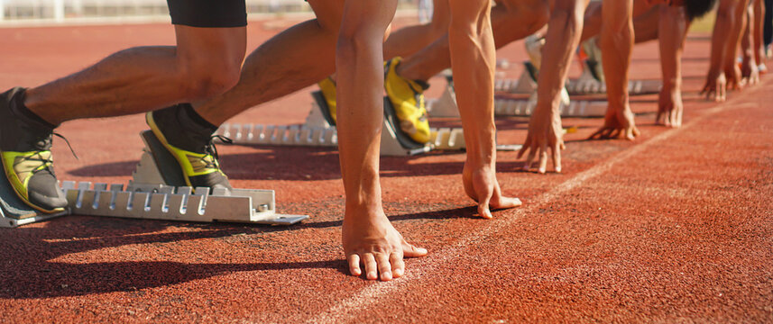 close up of runners feet on the track field