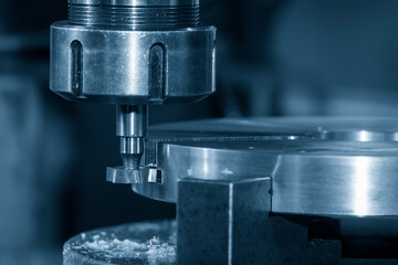 The T-slot cutting process on NC milling machine with T-slot cutter in the light blue scene.