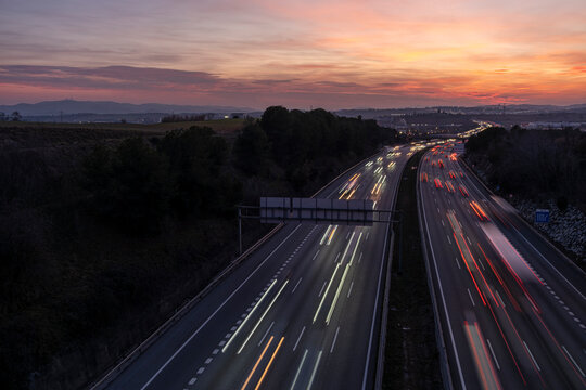 Elevated view of the AP-7 motorway at dusk as it passes through Mollet del Valles in the province of Barcelona in Catalonia Spain