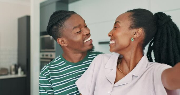 Face, kiss and selfie of couple in home, love or smile together on valentines day. Portrait, happy man and African woman take pictures, photography and laughing for romantic connection in kitchen