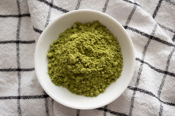 A dish of organic matcha powder.