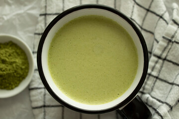 A cup of hot homemade matcha latte.