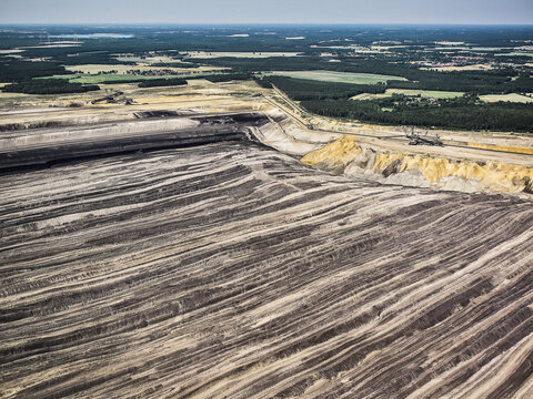 Aerial landscape of coal strip mine and large mining equipment. Welzow, Germany