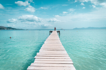 wooden pier on the turquoise sea