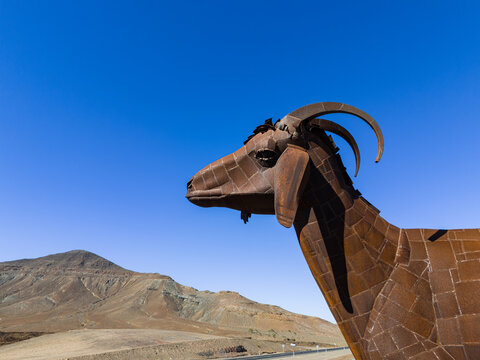 Antigua, Fuerteventura, Spain, November 19, 2023; Aerial image of the iron metal goat sculpture statue near Pozo Negro Fuerteventura Canary Islands Spain 