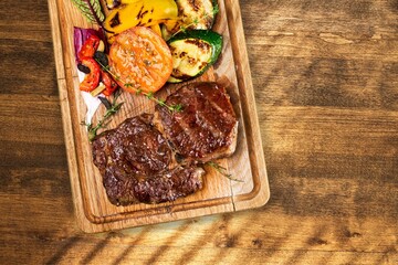 Grilled Steak tasty Filet with Vegetables on board