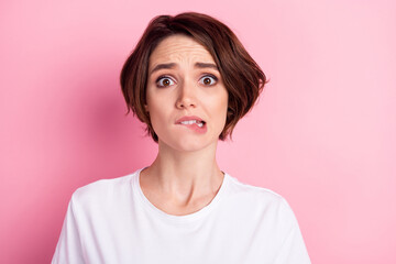 Photo portrait of woman with bob hairstyle frustrated biting lip staring stressed isolated on...