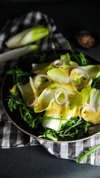 chicory leaves salad chicory fruit tasty fresh healthy eating cooking appetizer meal food snack on the table copy space food background rustic top view keto or paleo diet vegetarian vegan food