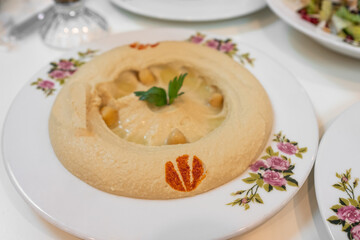 Hummus Plate, Lebanese plate of Hummus, mashed chickpeas with lemon, spices and herbs.