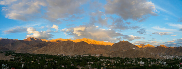 Panoramic view of Himalayas mountain range, from Shanti Stupa with golden sunlight in the evening.
